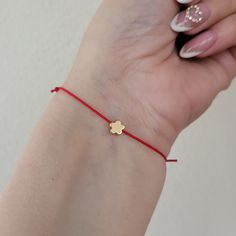 Flower bracelet, gold plated, dainty flower bracelet, charm bracelet, friendship, bff, make a wish, bridesmaids gift, Spring, adjustable Beautiful minimalist gold plated flower and string bracelet.  Mix and match with other bracelets available in our store, for an effortlessly chic look!  Also a perfect gift for your bff, your bridesmaids, or a special person in your life.  8 mm gold plated flower, moves loosely from imitate silk polyester string.  The bracelet is adjustable from 7-8 inches, it closes and opens through sliding knots.  You can adjust the bracelet by simply pulling the opposite threads.  The bracelet comes with adjustable cord in the color of your choice: Black, red, white, green, dark green,  light blue, blue, neon pink, yellow, dark red, dodger blue, indigo, colorful, pink Gold Charm Bracelet With Adjustable Length, Gold Charm Bracelet With Adjustable Length As Gift, Gold Friendship Bracelets With Adjustable Length As Gift, Minimalist Bracelets With Flower Charm As Gift, Gold Friendship Bracelets As Gifts, Delicate Adjustable Bracelets As Gift, Delicate Adjustable Bracelets For Gifts, Dainty Resizable Friendship Bracelet As Gift, Dainty Red Charm Bracelet As A Gift