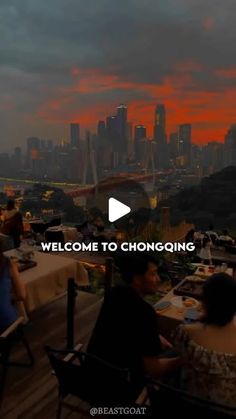 people are sitting at an outdoor table with the city skyline in the background and text that reads welcome to hong kong