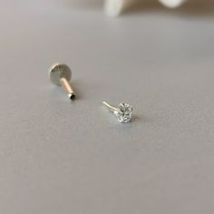 This is a set of a CZ ear piercing jewelry removable end, which has a AAA Cubic Zirconia prong setting, with a threadless push back post. RECOMMENDED WEARING POSITION EAR PIERCING - Helix, Earhead/Forward Helix - Tragus, Anti-Tragus/Surface Tragus - Cartilage/Flat - Conch, Inner Conch, Outer Conch - Lobe/Standard Lobe, Upper Lobe MATERIAL - AAA Cubic Zirconia - 925 sterling silver - 925 sterling silver threadless push back post MEASUREMENT * Removable End Size:- - CZ size : 2.5 mm, 3 mm, 4 mm * Minimalist Cubic Zirconia Piercings For Anniversary, Minimalist Cubic Zirconia Anniversary Piercings, Dainty Prong Setting Nose Studs As Gifts, Minimalist Cubic Zirconia Piercings For Everyday, Minimalist Cubic Zirconia Piercings With Prong Setting, Everyday Silver Cubic Zirconia Piercings, Tiny Minimalist Piercings For Anniversary, Minimalist White Piercings For Anniversary, Tiny Cubic Zirconia Cartilage Earrings For Everyday