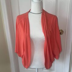 This Melon Orange Lightweight Sweater Is Very Drapy And Forgiving. Would Look Great With A Contrasting Color Like Blue. Bought It And Never Wore It Is A Os, But It Would Fit A 10-14 Easily. See Pics For Measurements Smoke Free Home Casual Fitted Open Front Tops, Casual Open Front Top In Solid Color, Casual Stretch Short Sleeve Cardigan, Casual Open Front Knit Top, Casual Open Front One Size Tops, Casual One Size Open Front Tops, Orange Sweater, Orange Sweaters, Lightweight Sweater