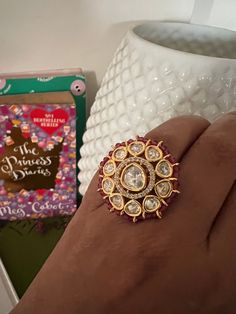 This gorgeous Kundan ring will add a perfect charm to your festive wear. One of our favourite picks for the wedding season  Size Adjustable  Red beads border Notice the zirconia stones bordering the center Kundan piece. Premium Quality Indian Kundan Jewellery, Kundan Ring, Indian Ring, Elephant Bangle, Ring Indian, Indian Rings, Stone Necklace Set, Vintage Elephant, Red Beads