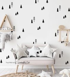 an elephant and some trees are on the wall in this kids's playroom