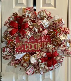 a red and white christmas wreath with cookies on it