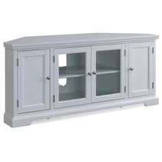 a white entertainment center with glass doors and shelves on each side, in front of a white background