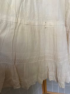 "Early 1900's white cotton petticoat dress. Buttons up the back, lace eyelet straps, large rip and stain spot. A couple of other small rips, being sold as is Bust: 34/35\" Waist: 25\" Hips: up to 47\" Armpit to hem: 45\"" Vintage Petticoat For Summer Daywear, Vintage Lace Trim Petticoat For Summer, Victorian Cotton Summer Dress, Victorian Style Cotton Summer Dress, Victorian Cotton Dress For Summer, Summer Cotton Victorian Dress, Victorian Summer Dress With Ruffles, Summer Victorian Cotton Dress, Summer Victorian Dress With Ruffles