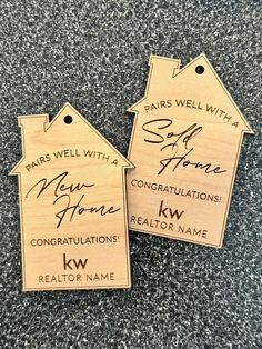 two wooden tags with the words paris well with a new home congratulationss kw realtor name