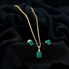 Product Details For women who like to keep it simple yet classy this Solitaire Pendant with a fine pair of Earrings is exclusively made for them. Embedded with the lush green colored Oval Shape Emerald and adorned with precious Moissanite, the Pendant and earrings can flawlessly go with various kinds of outfits. Product Information SKU SHP-PENDANT122040636 Length 12 mm Width 6 mm Weight 3.04 gm (Approximate) EMERALD INFORMATION No.of Stones 3 Pieces Total Weight 2.14 Carat (Approximate) Dimensio Emerald Green Earring, Elegant Oval Emerald Necklace, Formal Oval Emerald Jewelry, Formal Oval Pendant Emerald Necklace, Formal Emerald Oval Pendant Jewelry, Emerald Oval Pendant Necklace Gift, Vintage Emerald Earrings, Emerald Pendant Set, Emerald Earrings Drop