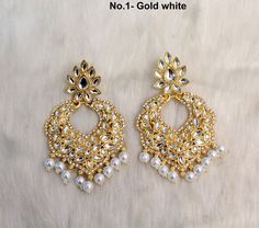 *Light weight kundan earrings. *No.1 *Earrings length- 2.7 inches (Included drops) *Earrings breadth- 1.7 inches *No.2 *Earrings length- 2.7 inches (Included drops) *Earrings breadth- 1.7 inches *No.3 *Earrings length- 2.7 inches (Included drops) *Earrings breadth- 1.7 inches *No.4 *Earrings length- 2.8 inches (Included drops) *Earrings breadth- 1.7 inches *No.5 *Earrings length- 2.8 inches (Included drops) *Earrings breadth- 1.7 inches *No.6 *Earrings length- 2.9 inches (Included drops) *Earrin Heavy White Drop Bridal Earrings, Nath Bridal, 4 Earrings, 3 Earrings, Indian Nose Ring, Kundan Jewelry, White Pastel, Jhumki Earrings, 2 Earrings