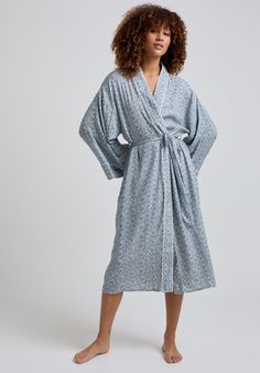 The charming Corina robe is cut from our inimitable cotton and adorned with an interesting blue Ditsy floral print. This oversized kimono-inspired robe boasts fluted sleeves and a detachable belt, creating a flattering silhouette. Contrast piping on the cuff and neck, complete this effortlessly feminine piece.    Cool machine wash only. Wash inside out and with similar colours 100% Cotton Modal   Cool machine wash only. Wash inside out and with similar colours Oversized Kimono, Fluted Sleeves, Luxury Scarves, Printed Robe, Floral Robes, July Birthstone Jewelry, Nightwear Women, Ditsy Floral Print, Contrast Piping