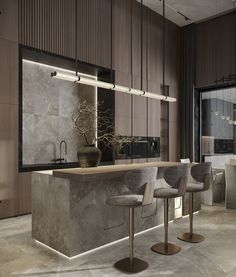 a modern kitchen with marble counter tops and stools in front of the bar area