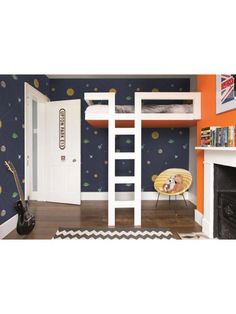 there is a bunk bed with a ladder next to it in the room that has an orange and blue wallpaper