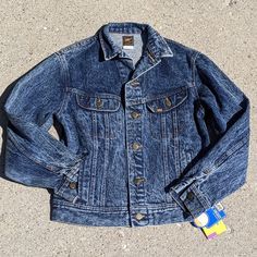 Amazing Deadstock (New With Tags) Rider Jacket By Lee In A Tagged Size 18. Basic Approx Measurements Are Pictured. Comparable To A Modern Large. Please Refer To Measurements For Best Fit. Blue Glacier Wash Full Button Front Button Wrists Lower Hand Warmer Pockets Upper Chest Button Pockets 100% Cotton Made In Usa Heavyweight Denim Trucker, 1980s, Unisex Retro Denim Blue Outerwear For Fall, Retro Dark Wash Outerwear With Snap Buttons, Retro Medium Wash Outerwear For Fall, Classic Fitted Winter Denim Jacket, Fitted Winter Denim Jacket With Snap Buttons, Winter Classic Fitted Denim Jacket, Classic Fitted Denim Jacket For Winter, Retro Fitted Denim Outerwear, Fitted Retro Denim Outerwear