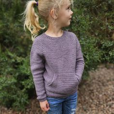 Crochet a cozy, stylish kids' sweater with this beginner-friendly pattern, perfect for everyday wear or sitting around a campfire. Featuring a classic raglan design, a functional front pocket, and short rows for a comfortable, custom fit, this pattern is quick to make and ideal for adventurous kids. With a step-by-step video tutorial for short rows, crocheters of all skill levels can easily follow along. Difficulty: This is an intermediate level pattern. This pattern uses a simple stitch pattern and some advanced shaping with short rows. Sizes: 2T (4T) 6T (8) 10 Yarn: You will need the following amounts of a light worsted or DK weight (3) yarn given as: 2T (4T) 6T (8) 10 meters: 650 (750) 900 (1050) 1200 yards: 700 (830) 1000 (1150) 1300  Suggested Hook Size & Notions: 4 mm crochet hook 3. Crochet Sweater For Kids, Crochet Raglan Sweater, Single Crochet Decrease, Animal Sweater, Simple Stitch, Sweater Patterns, Yarn Cake, Pocket Sweater, Raglan Sweater