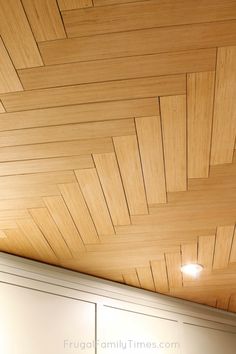 the ceiling is made from wood and has an interesting pattern on it's surface