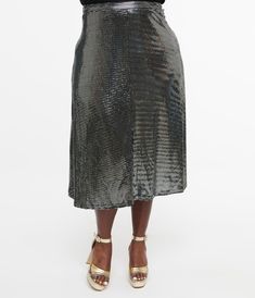 This stunning 1970s plus size metallic silver skirt shimmers and shines with every twirl, making it perfect for parties or just a fun night out. The flattering midi length and comfortable fit ensure you'll feel as fabulous as you look while the sleek back zipper adds that touch of effortless elegance.Available in sizes XS-4X while supplies last. Chic Metallic Skirt With Sequins, Chic Metallic Sequin Skirt, Fitted Metallic Holiday Skirt, Metallic Sequin Skirt For Night Out, Glamorous Metallic Skirt For Holidays, Glamorous Knee-length Party Bottoms, Glamorous Metallic Holiday Skirt, Glamorous Metallic Skirt For Spring, Glamorous Shiny Skirt For Party Season