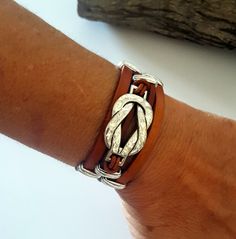 "Infinity leather Bracelet, leather cuff, magnetic clasp, Bohemian style, gift idea, for her, for him, unique design, handmade, leather How do I know what size I need? Just wrap a flexible measuring tape around your wrist and measure. The tape measure should rest on the wrist but not too tight. Just so that it feels comfortable for you. We plan on making \"space\" for opening and closing. Check out our \"Necklaces\" and \"Earrings\" for matching pieces ! can I choose different sizes ? Bracelets: Handmade Trendy Brown Wrap Bracelet, Trendy Handmade Brown Wrap Bracelet, Bohemian Wrap Bracelet With Sliding Knot, Bohemian Leather Bracelet As A Gift, Leather Bracelets Women, Bracelet Leather, Small Charms, Measuring Tape, Leather Cuffs