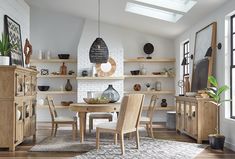 a dining room filled with lots of wooden furniture