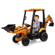 a young boy sitting in the back of a toy tractor