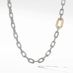 In the DY Madison(R) Collection, classic chain takes on new life under the artful eye and skillful hand of David Yurman. This sculpted design features a contrasting single link of gold for a striking focal point. Sterling Silver with 18-karat Yellow Gold Necklace, 8.5mm Push clasp 36 Inches in length Convertible chain necklace: Can be worn as a necklace and a bracelet Style Number: N14563 S83625 Yellow Gold Necklace, Silver Chains, Chain Link Necklace, High Jewelry, Link Necklace, David Yurman, Unique Engagement Rings, Jewelry Pouch, Unique Rings