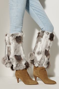 Fashion up your city boots with warmth and dazzle. Our cool Spanish rabbit fur toppers slide right over your boots to insulate from wind and cold, with smooth polyester lining offering an easy glide. They stay put with elastic closures, while the high end ties with twisted tassels finished with raccoon fur poms. Genuine Rabbit Fur. Winter Boots With Plush Lining And Faux Fur, Winter Faux Fur Boots With Plush Lining, Winter Faux Fur Boots For Cold Weather, City Boots, Boots With Leg Warmers, Cotton Casual Pants, Boot Toppers, Fur Shoes, Slippers For Women