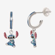 Character: StitchEarring Back: PostSetting: ChannelMetal Color: WhiteEarring Length: 20.2mmEarring Width: 8.2mmMetal: Sterling SilverCare: Wipe CleanEarrings Style: Hoop EarringsCountry of Origin: Imported Lilo And Stitch Merchandise, Stitch Stuff, Stitch Hoodie, Stitch Gift, Jewelry Boards, Disney Character, Birthday List, Earrings Hoop, Earrings Studs