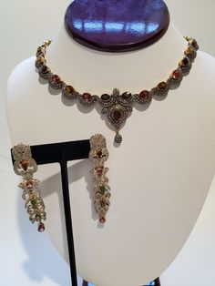 "You are viewing a beautiful set of Vintage 14k solid gold & sterling silver multicolored tourmaline stones and diamond necklace and earrings set. The earrings measures approx.2 7/8 inches long x 5 /8 inches wide. The earrings total weight is approx.20.79 grams. The diamond total weight approx. 1.50ctw While the multicolored tourmaline stones is 3.02 ctw. This earrings is tested 14k yellow and white gold. The earrings is very unique and the diamond are sparkly its merge with all the differen Fine Sterling Silver Jeweled Jewelry, Fine Sterling Silver Jewelry, Fine Jewelry Sterling Silver Jeweled, Multicolor Diamond Accented Jewelry For Weddings, Multicolor Diamond Accented Wedding Jewelry, Multicolor Wedding Jewelry With Diamond Accents, Fine Multicolor Jewelry With Diamond Accents, Multicolor Diamond Jewelry Set With Matching Earrings, Formal Multicolor Necklaces With Matching Earrings