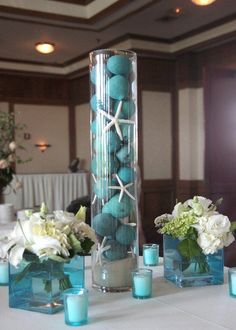 a tall vase filled with blue and white flowers