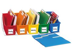 colorful file folders with name labels and dividers on each side are lined up in a row