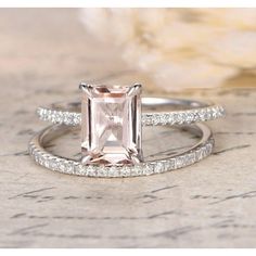 an engagement and wedding ring set in white gold with a pink morganite center stone