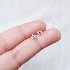 Real 925 Sterling Silver Tiny Hollow Star Stud Earrings These lovely earrings can be used in Earlobe, Tragus and Cartilage. Measures 6mm Comes with pushback backings Sold by Pair Jewelry will come in a gift box * Please read shop policy before placing an order * *JEWELRY CARE* Sterling Silver will tarnish over time, but to help keep your jewelry looking beautiful - Clean with a soft dry cloth after wear and store inside an airtight bag or container. Remember to remove your jewelry when: * Applyi Minimalist Nickel-free Star Shaped Jewelry, Minimalist Nickel-free Star-shaped Jewelry, Minimalist Nickel-free Star Jewelry, Minimalist Star-shaped Nickel-free Jewelry, Silver Star-shaped Cartilage Earrings With Pierced Design, Silver Star-shaped Pierced Cartilage Earrings, Silver Dainty Star Charm Earrings, Silver Dainty Earrings With Star Charm, Sterling Silver Star-shaped Single Earring