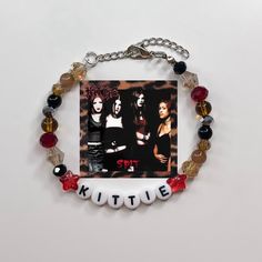 Kittie Album Cover Bracelet                                All Jewelry is Handmade with love and care by myself, Gabby. These are limited quantity while supplies last however, if something is sold out, message me to see if I can make you one! Every sale goes back into growing my shop and helps my dream of turning my small business into a fulltime job!🖤 Made with: glass beads, and plastic letter beads on a stainless steel wire with a 4cm stainless steel adjustable chain.  * Length is 18cm + 4cm Trendy Handmade Jewelry For Concerts, Handmade Adjustable Grunge Jewelry, Handmade Punk Style Bracelets As Gift, Handmade Adjustable Jewelry For Concert, Adjustable Punk Beaded Bracelets As Gift, Handmade Y2k Style Bracelets Gift, Y2k Style Beaded Bracelets As Gift, Handmade Adjustable Y2k Beaded Bracelets, Deftones Bracelet