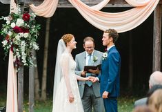 a bride and groom exchanging vows at their wedding