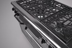 an oven with four burners on the front and one in the back, is shown