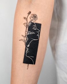 a woman's arm with a rose tattoo on the left side of her body