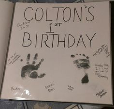 a book with handprints on it that says, cotton's 1st birthday