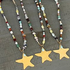 This 18" mixed beads necklace features natural stones and a signature star charm. Each necklace is one-of-a-kind, making it the perfect accessory to showcase your individuality. Complete your look with the calming and harmonious energy of Amazonite. Adjustable Star-shaped Necklace With Colorful Beads, Star Charm Necklace For Festivals, Bohemian Beaded Necklace With Starfish Charm As Gift, Handmade Star Beaded Necklaces For Festivals, Bohemian Beaded Necklaces With Starfish Charm For Gifts, Handmade Star-shaped Beaded Necklace For Festivals, Star-shaped Beaded Necklace For Festival, Bohemian Starfish Beaded Necklaces, Bohemian Beaded Starfish Necklace