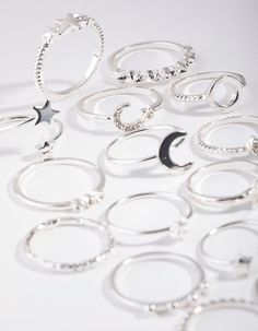 Stay ahead of the latest ring stacking trends with our multi ring stack packs. This stunning silver-toned pack features a celestial motif and will have you shining from day to night. | Lovisa Silver Celestial Ring 24-Pack Ring Stack Silver, Hamsa Ring, Piercings Nose, Celestial Ring, Fashion Jewellery Online, Gold Hamsa, Nose Piercings, Bold Earrings, Round Engagement Rings