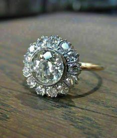 "Specification:- *Diamond Material : Moissanite *Center Diamond Cut : Old European Cut *Total Diamond Weight : 3.43 CT (Approx) *Center Diamond Dimension : 9.00 MM *Center Diamond Weight : 2.75 CT *Side Diamond Dimension : 2.30 MM *Side Diamond Weight : 0.68 CT *Diamond Color : White *Diamond Clarity : VVS *Certificate : AGL ASIA (ONLINE) *Making Process: Handmade by our Experienced Staff. *Stamp: Our All Rings Stamped According to metal Purity (925 SIL/10K/14K/18K). Custom Order:- *We do Accept Moissanite Round Rings For Marriage, Moissanite Marriage Ring, Moissanite Ring With Diamond Accents For Marriage, Moissanite Diamond Ring With Diamond Accents For Marriage, Dazzling Diamond White Diamond Ring For Marriage, Heirloom Moissanite Halo Wedding Ring, Heirloom Style Moissanite Halo Wedding Ring, Wedding Halo Ring With Rose Cut Diamonds, Diamond White Moissanite Ring For Marriage