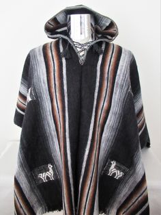 This Poncho is absolutely beautiful and warm, perfect for the winter and autumn seasons because its fiber is highly warm. Its softness and lightness make it a unique garment. Material: Alpaca blend Measurements: 72 X 50 inches Will fit people sizes ranging from medium to large. Weight: 2 pounds Made in Peru Black Alpaca Poncho For Winter, Casual Alpaca Poncho For Winter, Black Alpaca Cape For Winter, Traditional Wool Poncho For Winter, Brown Alpaca Poncho For Winter, Black Alpaca Outerwear For Winter, Brown Alpaca Winter Cape, Traditional Black Cape For Fall, Alpaca Shawl Outerwear For Winter