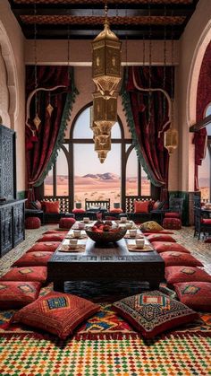 a living room filled with lots of furniture next to a large window covered in curtains