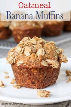 a close up of a muffin on a plate with oatmeal in the background