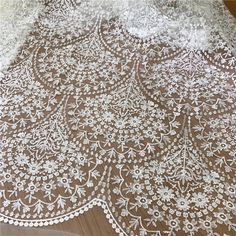 Beautiful Embroidery flower lace fabric This is a new style in high quality. Great for wedding dress, evening gown, Costume, cocktail dress This Listing is sell for fabric, not include the dresses Color: off white Width - 51 inches, Length- yard Wholesale acceptable, please convo me Shipping Time: United Sates: 10-15 working days United Kingdom:10-15 working days Canada: 10-15working days Australia: 10-15 working days Asia:4-8 working days Europe: 10-20 working days need express mail service , p White Embroidered Lace Fabric, White Lace Embroidered Fabric, White Scalloped Lace Embroidered Fabric, Lace Embroidered Fabric With Lace Trim For Wedding, Wedding Embroidered Lace Fabric With Lace Trim, Cream Lace Fabric With Embroidered Lace Patchwork, White Lace Wedding Dress With Floral Embroidery, White Lace Wedding Dress With Lace Patchwork, White Lace Wedding Dress With Intricate Embroidery