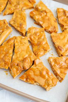 there are many pieces of food on the baking sheet ready to be baked in the oven