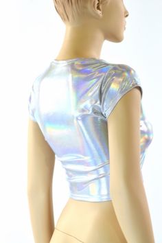 "This item is made to order, please read all the way through the listing before purchasing! This shiny, liquidy holographic top has a smooth reflective finish that bends the light in beautiful shifting rainbows. It features a scoop neckline and cute little cap sleeves. Four way stretch spandex for a great fit! TOP LENGTH: Underarm to hemline measures 8\" Womens Sizing (See below for instructions on where measurements should be taken) XXS: Bust 29\"-30\" / Waist 22\"-23\" / Hips 30\"-32\" Extra S Metallic Shiny Fitted Tops, Fitted Metallic Shiny Tops, Fitted Iridescent Tops, Fitted Metallic Tops For Festival, Fitted Silver Top For Festivals, Holographic Crop Top, Holographic Top, Festival Outfit Inspiration, Olive Branch