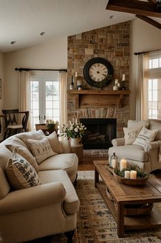 a living room filled with furniture and a clock on the wall above it's fireplace