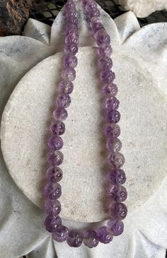 Beautiful Circa 1930s Old Chinese Carved Amethyst Shou Bead Vintage Necklace Beads are slightly graduated in size measures a little over 18 inches around weighs 77 grams of Gemstone Vintage Purple Round Beads Jewelry, Vintage Purple Round Bead Jewelry, Lavender Beaded Necklace With Faceted Round Beads, Amethyst Crystal Necklaces With Polished Round Beads, Lavender Beaded Necklaces With Faceted Beads, Lavender Single Strand Round Bead Jewelry, Lavender Single Strand Jewelry With Round Beads, Purple Hand-strung Necklaces, Lavender Amethyst Crystal Necklaces With Round Beads