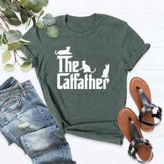 "The Cat Father T-Shirt, Funny Cat Dad Shirt, Funny Cat Owner Shirt, Father's Day Shirt,Classic Cat Dad Shirt, Cat Daddy Tee,Cat Father Shirt Please Check All Photos For Details.   🐞Choose Your T-Shirt Size From The Drop-Down Lists Next To The item Picture   ⭐Choose Of Your T-Shirt Color From The 2nd Picture   🐞Use \"Add message to Seller\" link On The Checkout Page To Send me the Following important Details For Your Order's Customization.   ⭐Shipping Time Varies by location (we are located in Sugar Land, Texas) please consider that our turn around time is 1 to 3 business days.     ⭐Which brand do you use for t-shirts? We use Gildan Softstyle, Bella Canvas Unisex, Hanes, Outlash, Tees,  District and Next Level when we have a shortage of stocks for certain colors and sizes. Our printing m Cat Dad Shirt, Cat Tshirts Funny, Father Shirts, Sugar Land, Tshirt Funny, Cat Owner, Fathers Day Shirts, Dad Humor, Comfort Color