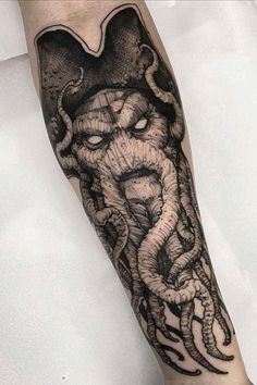 an octopus tattoo on the arm and leg