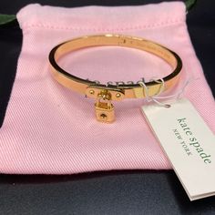 Gorgeous Kate Spade Bangle With A Dangling Charm Brand New With Tags Comes With Dust Bag Kate Spade Gold Bracelets, Kate Spade Gold Bracelet Jewelry, Kate Spade Everyday Bracelet Jewelry, Kate Spade Gold Bracelet, Adjustable Metal Bracelet By Kate Spade, Everyday Kate Spade Bracelet, Kate Spade Adjustable Gold Bracelets, Adjustable Gold Kate Spade Bracelets, Elegant Gold Wristlet As Gift