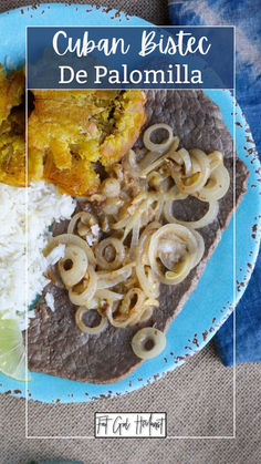 a blue plate topped with rice and meat covered in sauce next to other food items